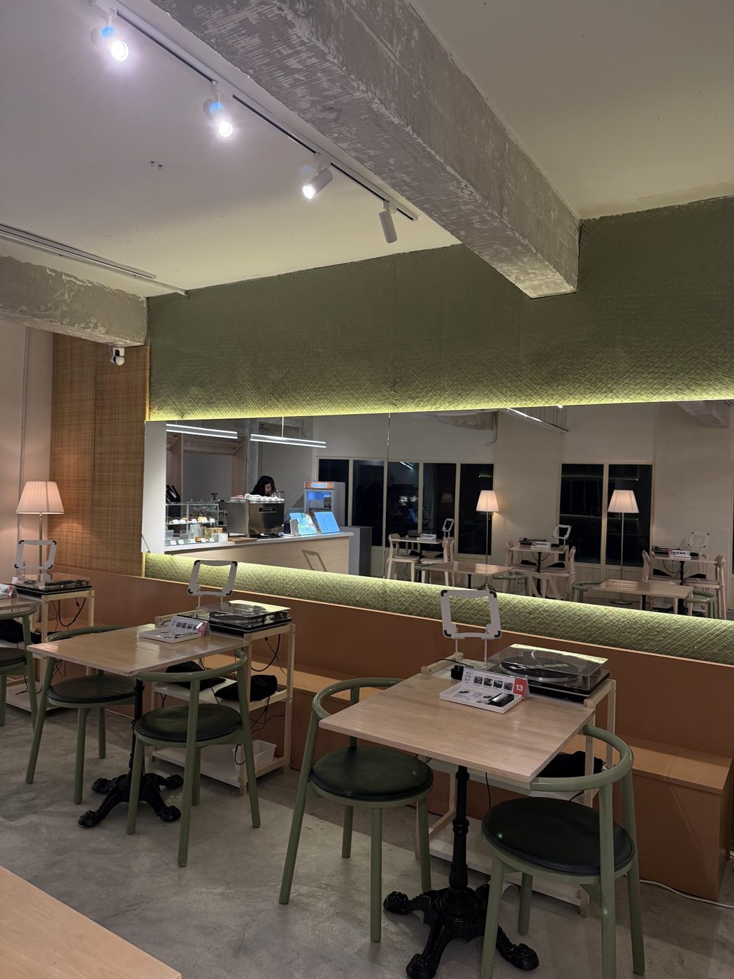 Cafe interior with sage green chairs