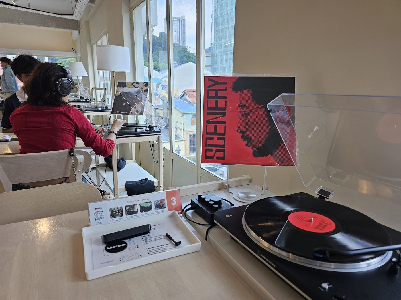 A turntable and latte at a listening station